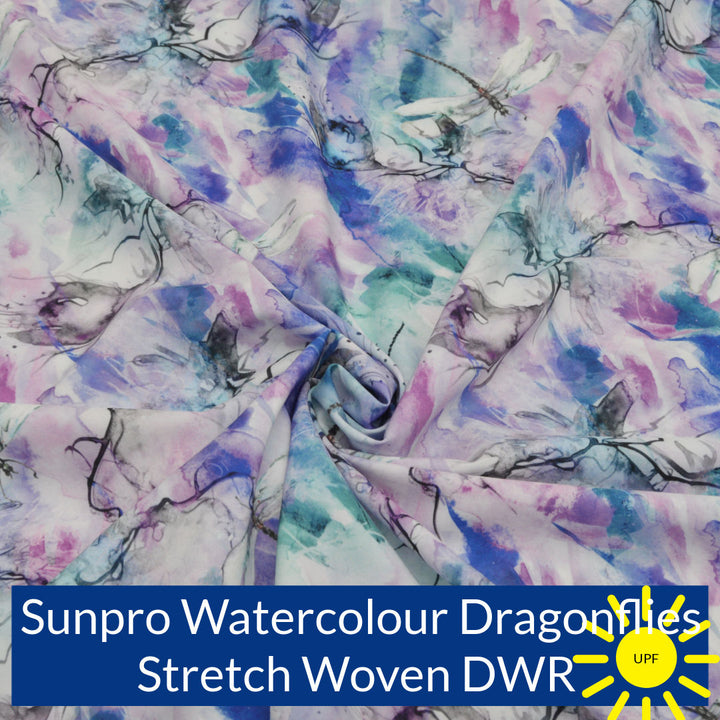 Water colour prints in shades of royal blue pink and jade green with soft black and grey outlines of dragonflies fabric swatch