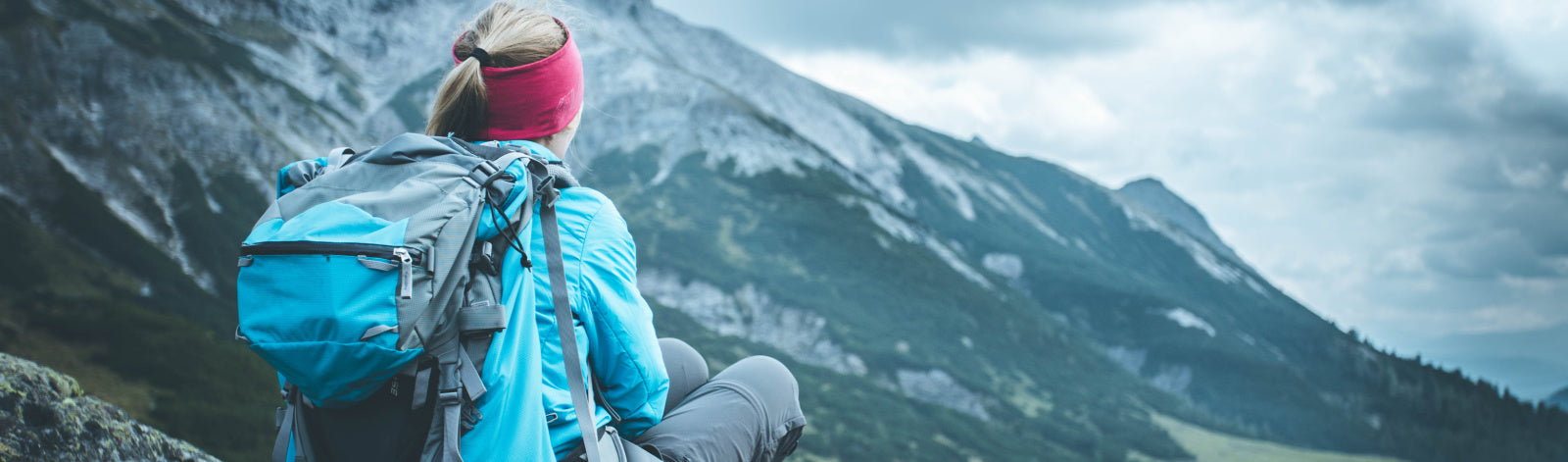 Woman sitting on Mountain