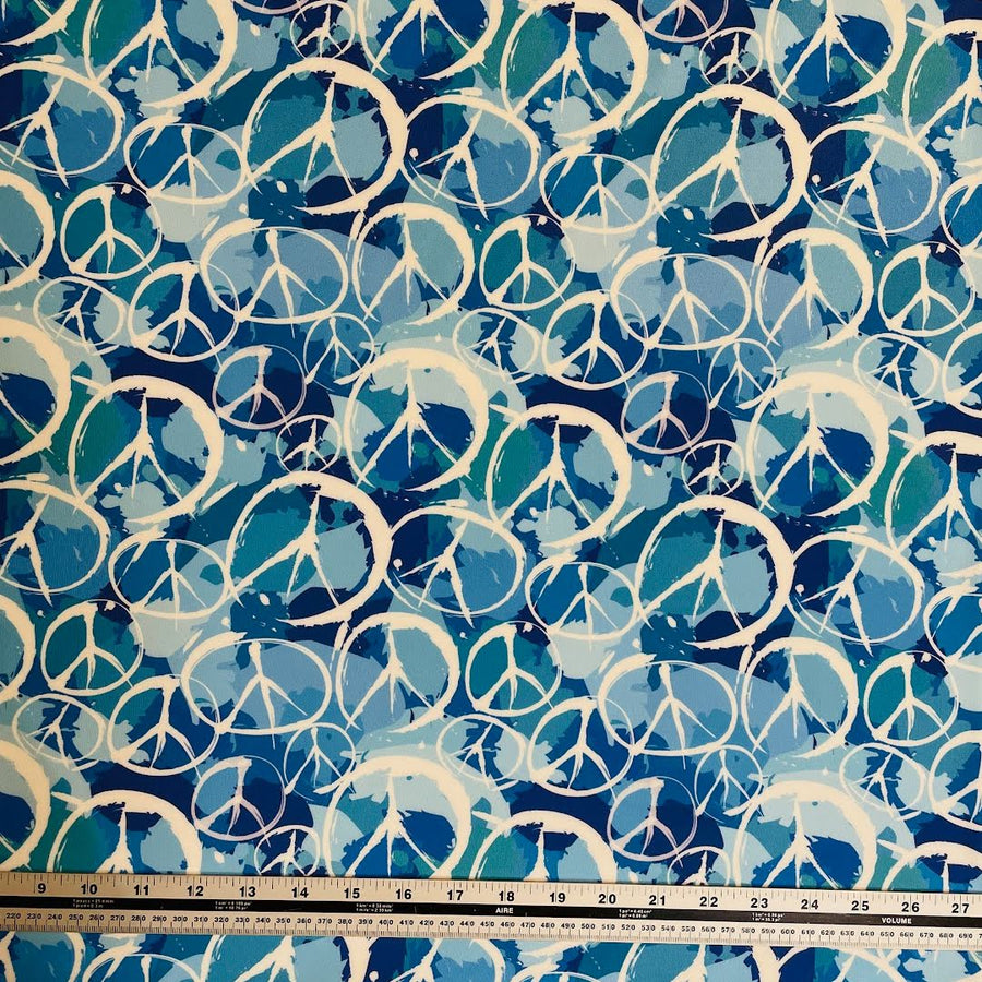 blue and white peace signs polartec power dry heavy weight print fabric