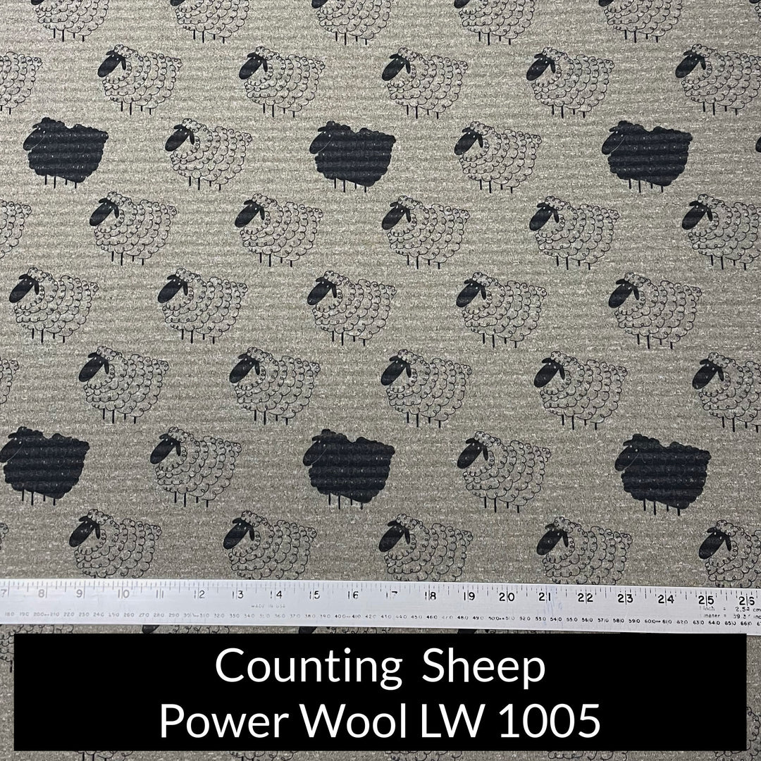 Polartec Power Wool LIghtweight in heather grey green with a simple print of wooly cartoon sheep