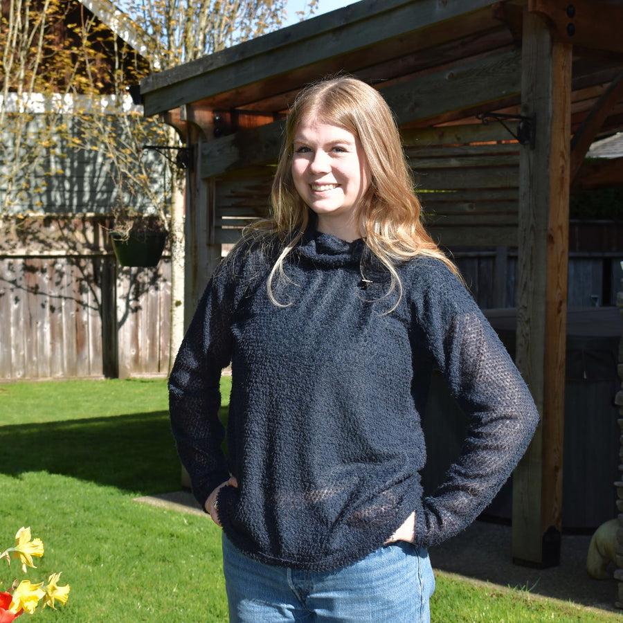Girl wearing navy hoody made from Alpha Direct Fabric