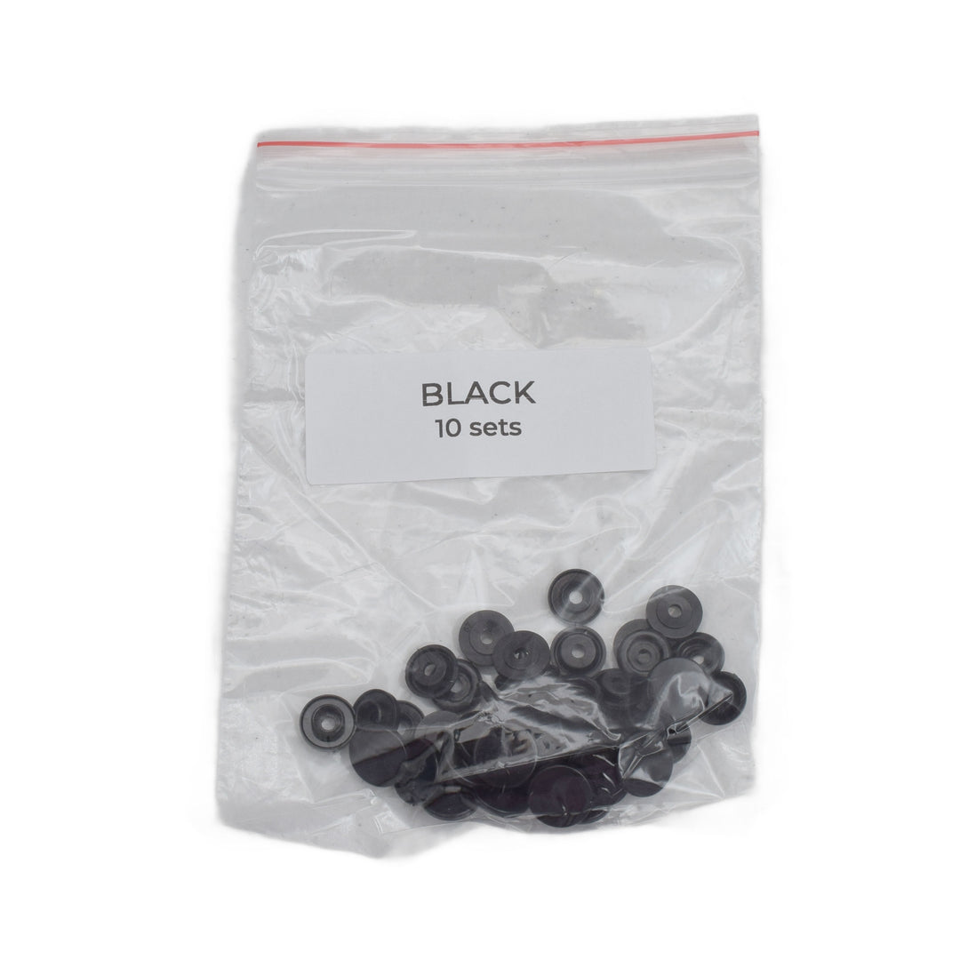 A clear plastic zip-top bag containing 10 sets of small size T5 black snaps, with a white label reading 'BLACK 10 sets'.