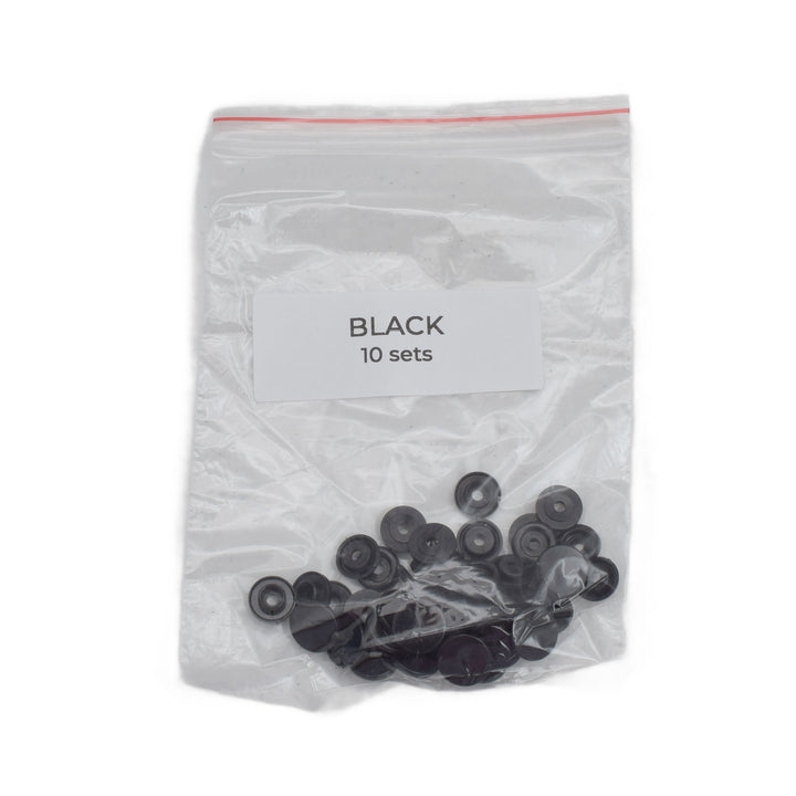 A clear plastic zip-top bag containing 10 sets of small size T5 black snaps, with a white label reading 'BLACK 10 sets'.