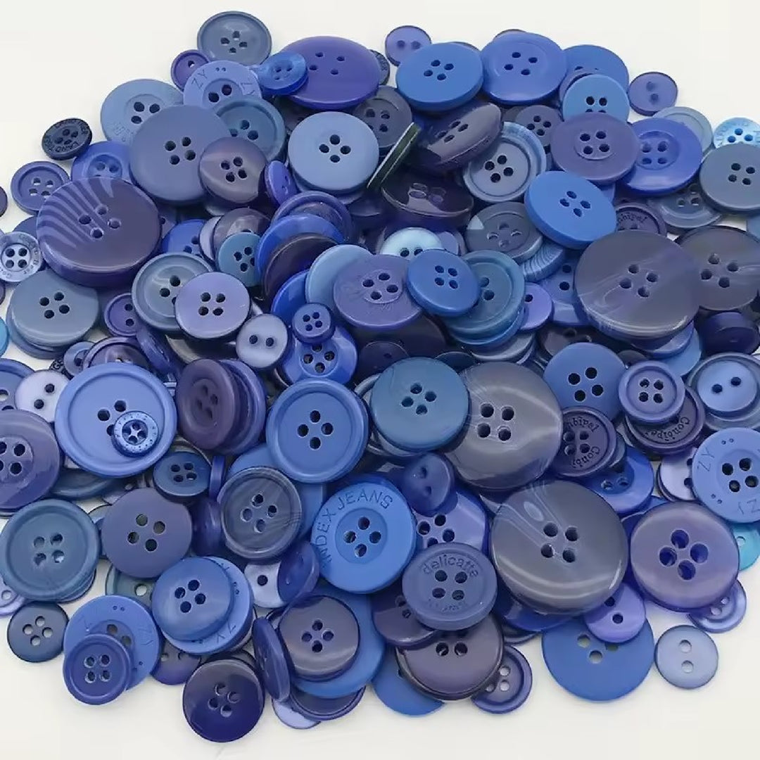 Pile of blue buttons in different sizes and shades