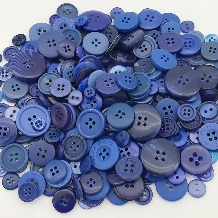 Pile of blue buttons in different sizes and shades