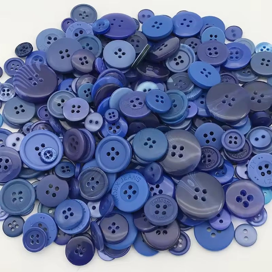 Pile of blue buttons in different sizes and shades