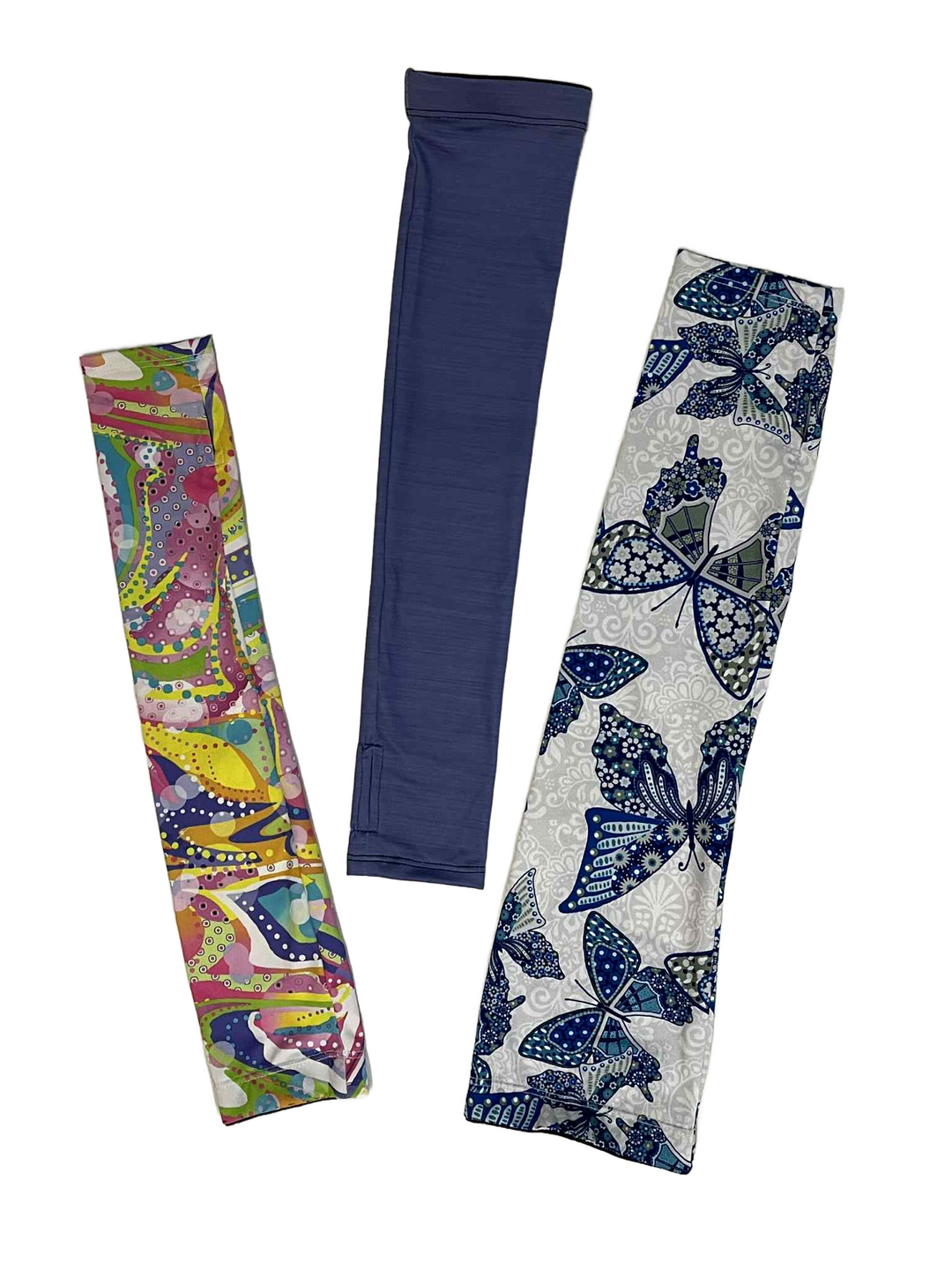 Three arm sleeves with different patterns on a white background
