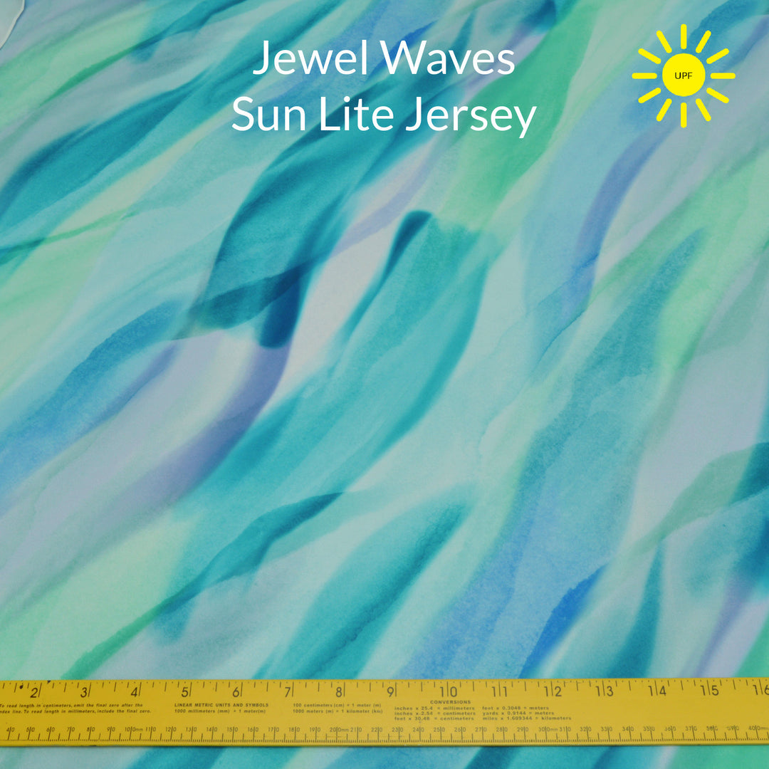 water colour jewel tone waves in teal green blue and purple sun lite jersey