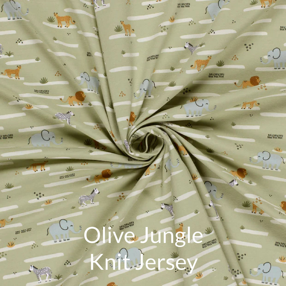 Fabric swatch of cute children's print of African animals on a pale olive background