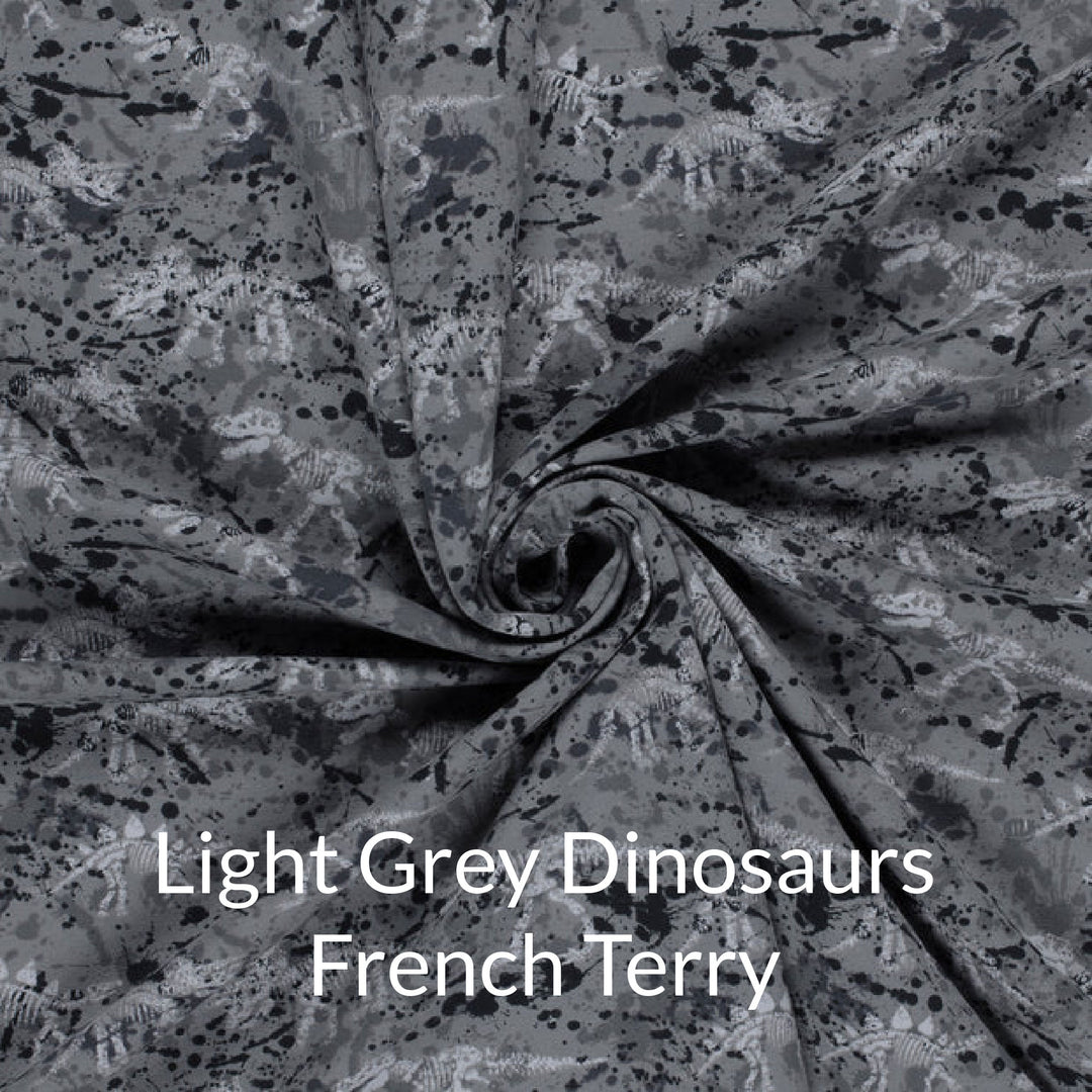 French terry fabric swatch of dinosaur skeleton print in shades of grey