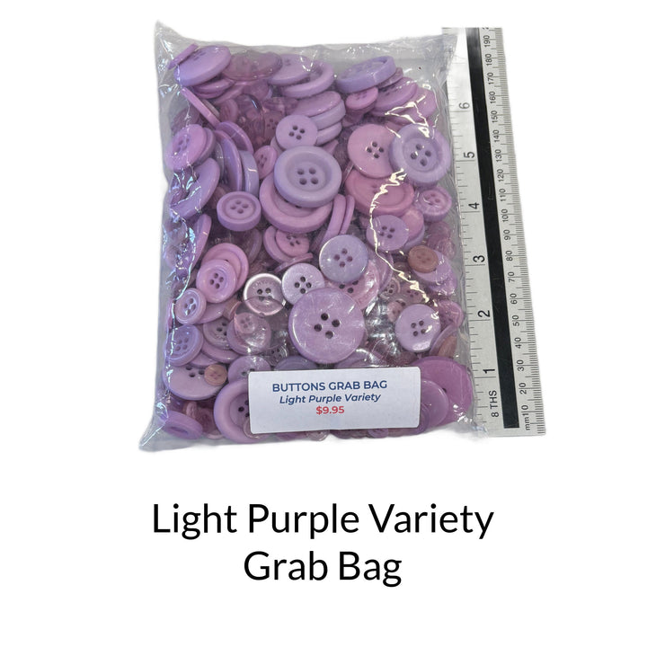 Mixed bag of light purple buttons in different sizes and shades