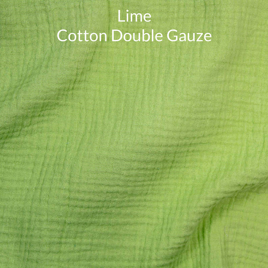 Close-up of lime green cotton double gauze fabric with text overlay.
