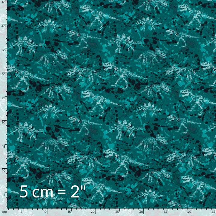 Printed fabric swatch in shades of petrol teal green showing various dinosaur skeletons and a ruler for scale