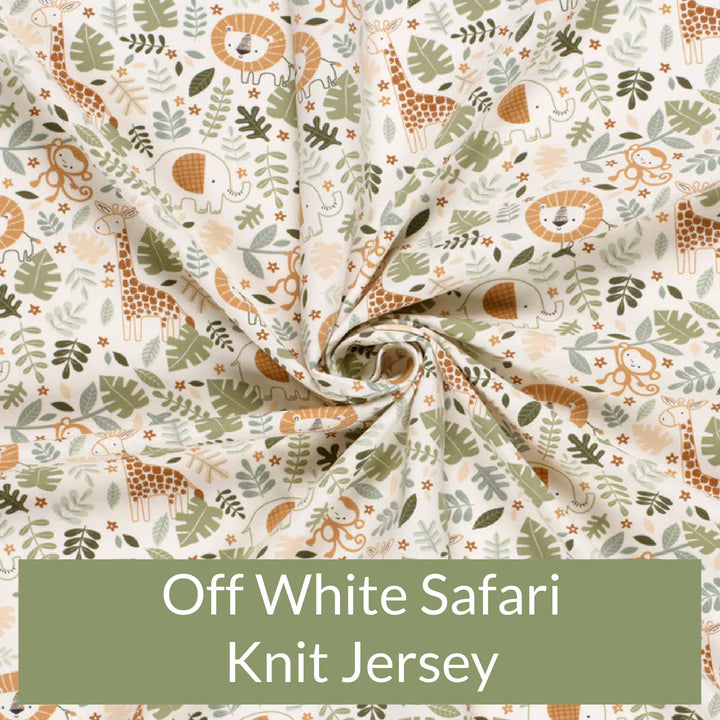 Fabric swatch of cute children's print of safari animals and leaves on an off white background 
