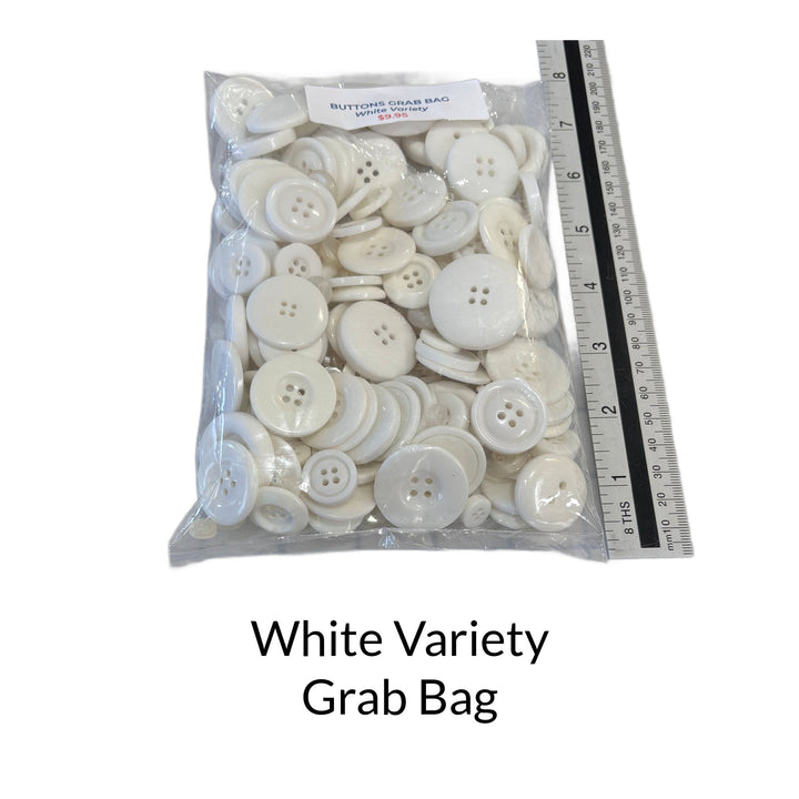Mixed bag of white buttons of different sizes and shapes