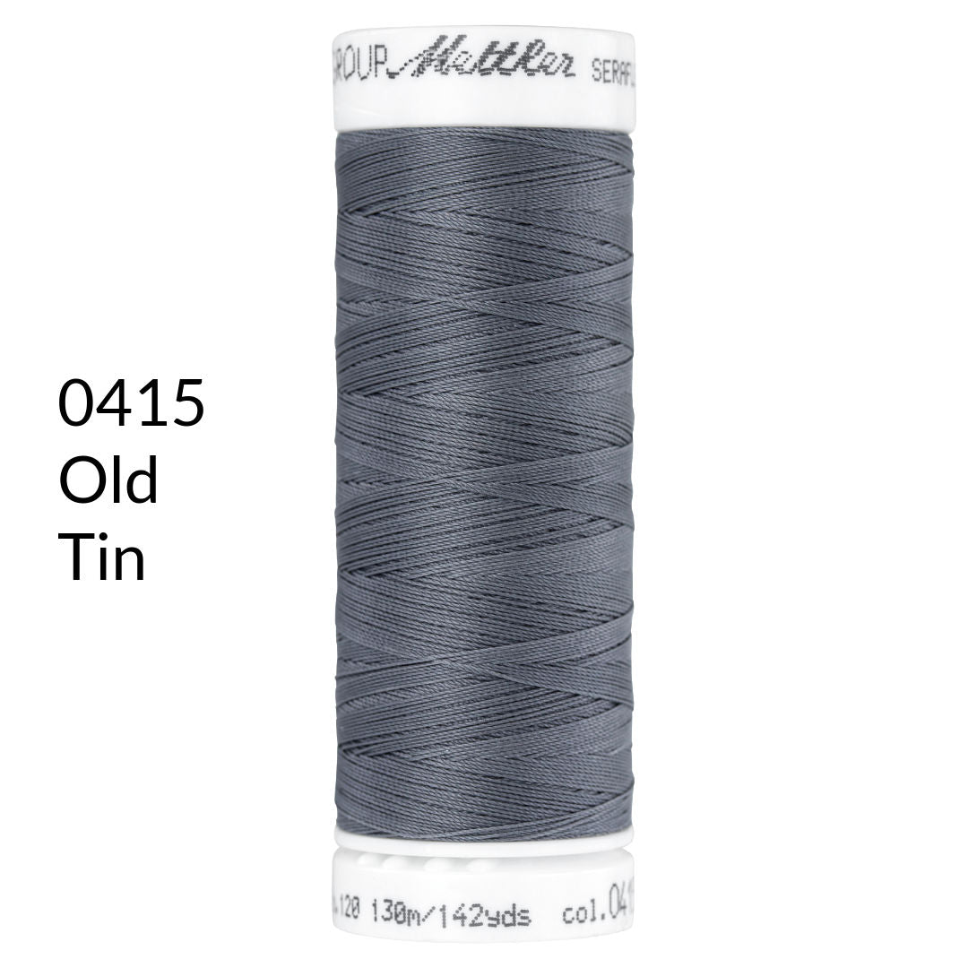 old tin dark grey stretch sewing thread