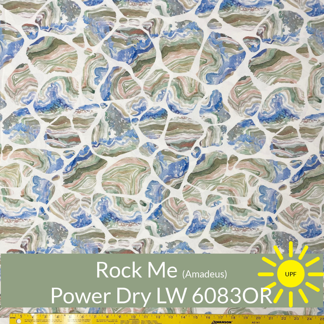 Random sized rounded blue olive rust shade pebbles on white polartec power dry lightweight #color_6083or-rock-me