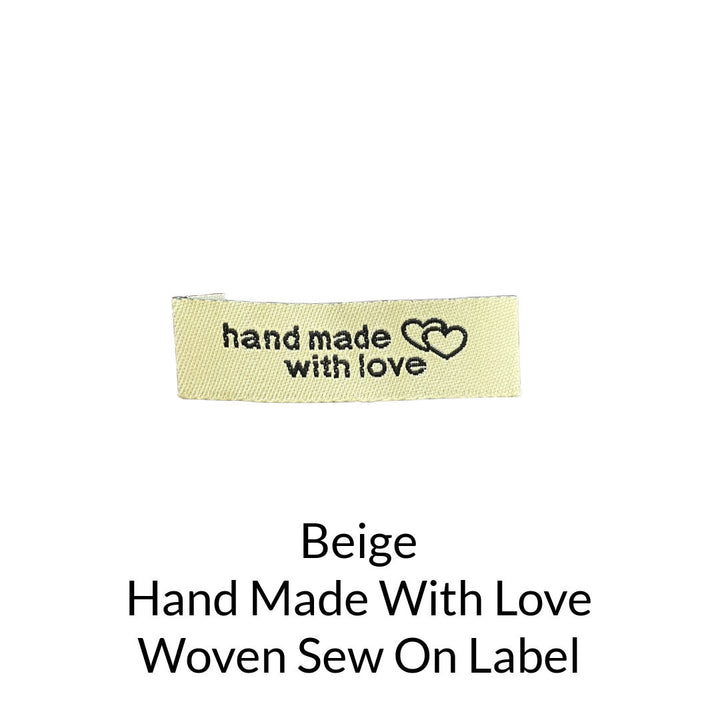 black writing on beige background woven sew on label
