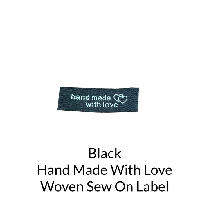 white writing on black background woven sew on label