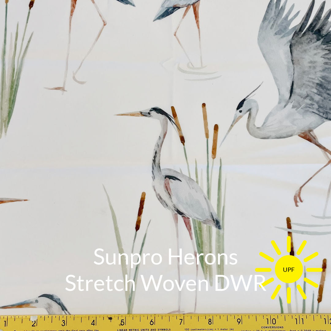 water colour grey blue herons in bull rushes printed on white background sun pro sun protection stretch woven fabric