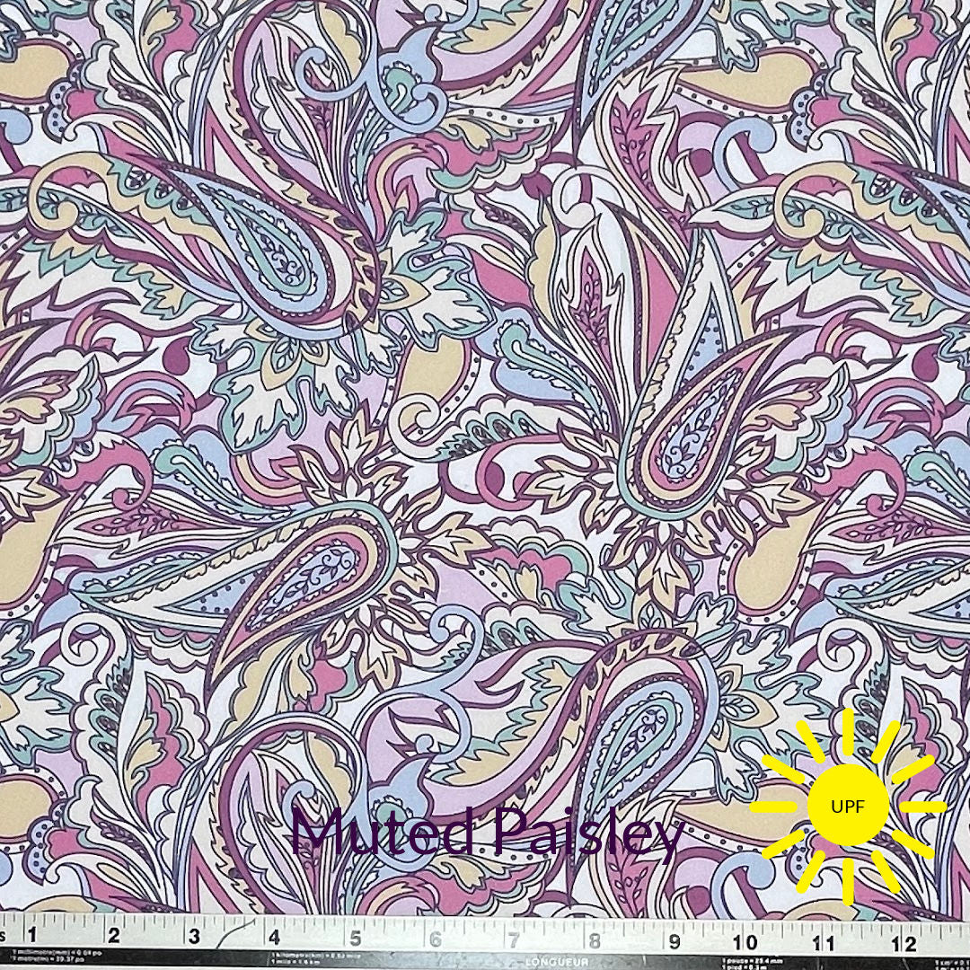 soft pink plum green blue and yellow paisley print on white background sun protective breathe tek athletic fabric